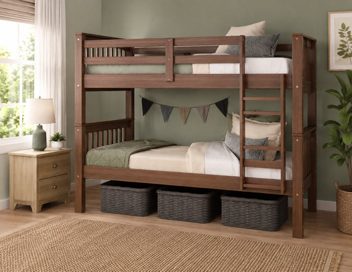 A brown wooden mocha colored bunk bed with a ladder, styled in a bedroom with a green wall, a wooden nightstand, a lamp, a plant, and three storage baskets underneath.