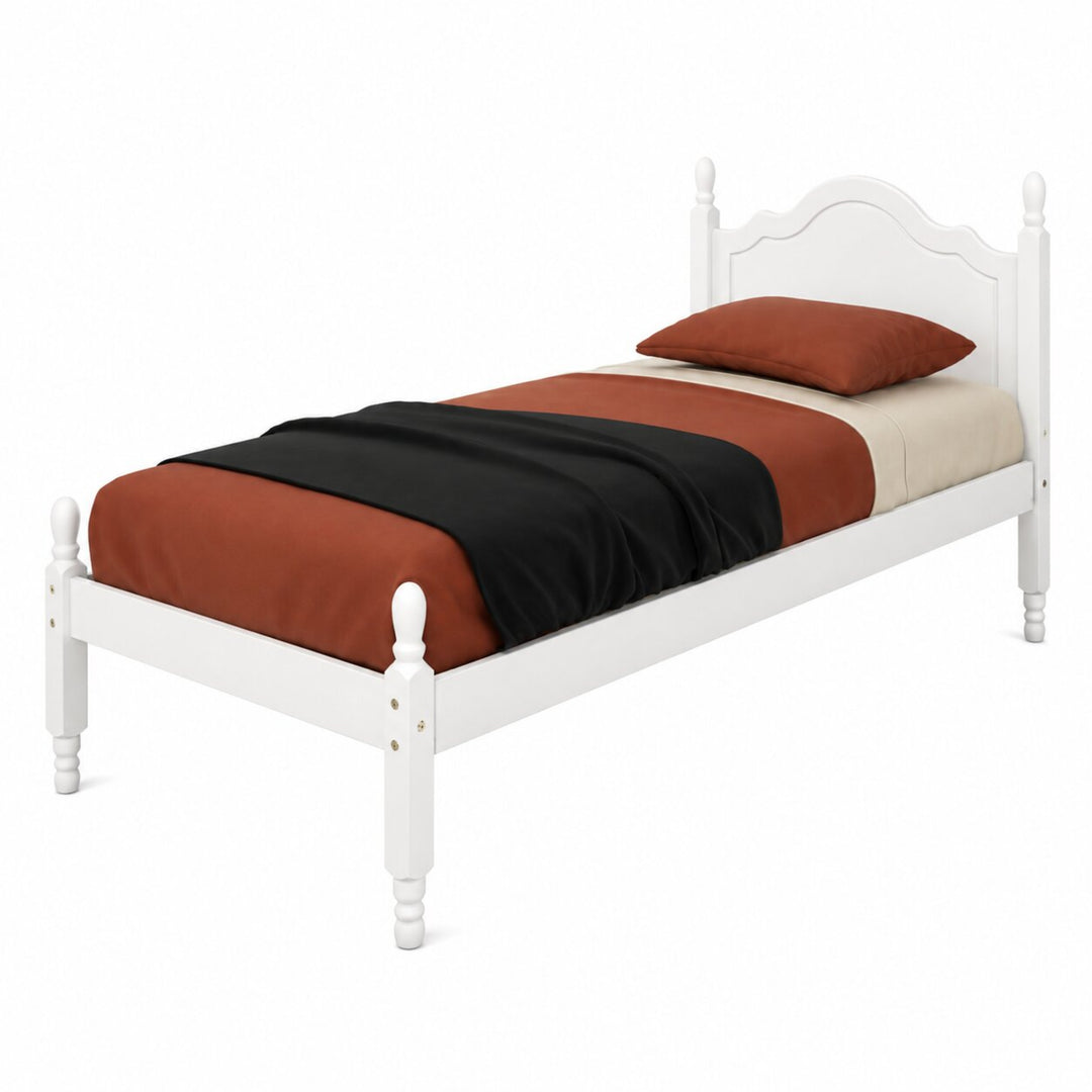 A white wooden twin bed frame with a curved headboard and turned legs, styled with rust-orange, black, and cream bedding and a matching pillow on a white background.