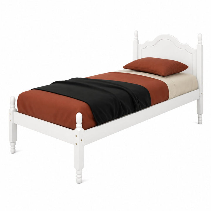 A white wooden twin bed frame with a curved headboard and turned legs, styled with rust-orange, black, and cream bedding and a matching pillow on a white background.